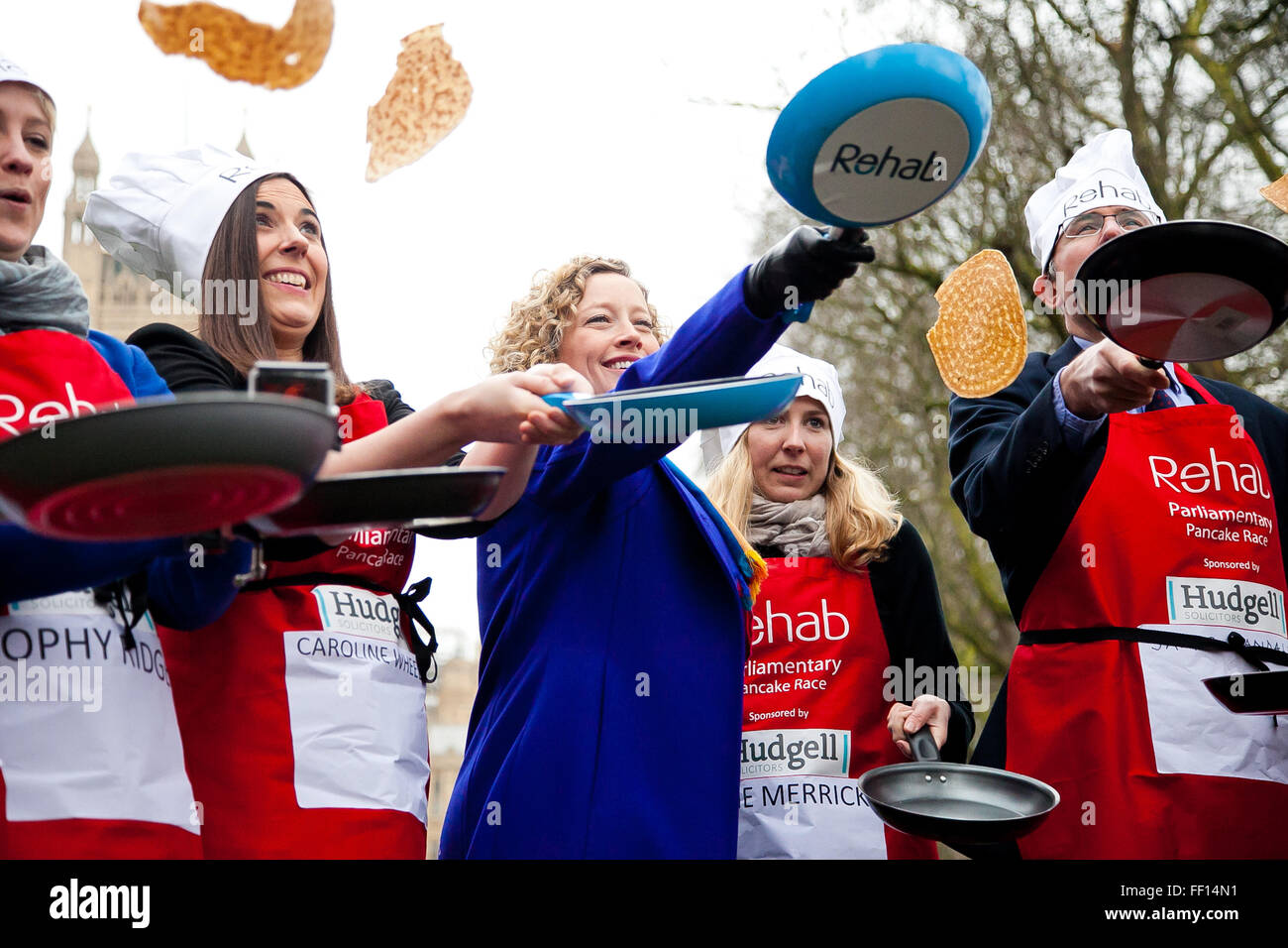 Westminster, London, United Kingdom. February 9th, 2016 -  The media team - last year's winners of the annual Parliamentary pancake race pose for photos while tossing pancakes Credit:  Dinendra Haria/Alamy Live News Stock Photo