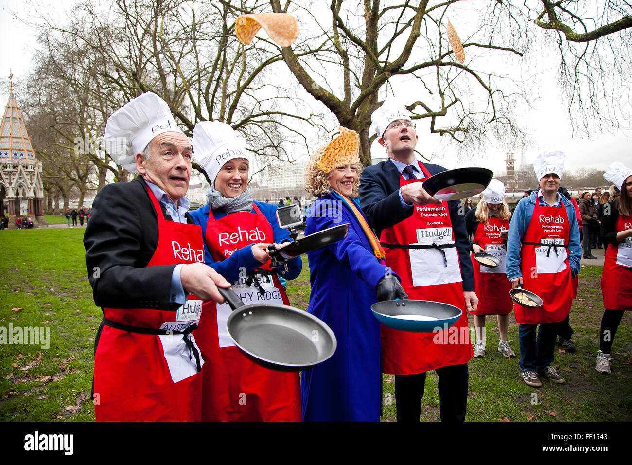 Westminster, London, United Kingdom. February 9th, 2016 -  The media team - last year's winners of the annual Parliamentary pancake race pose for photos while tossing pancakes Credit:  Dinendra Haria/Alamy Live News Stock Photo