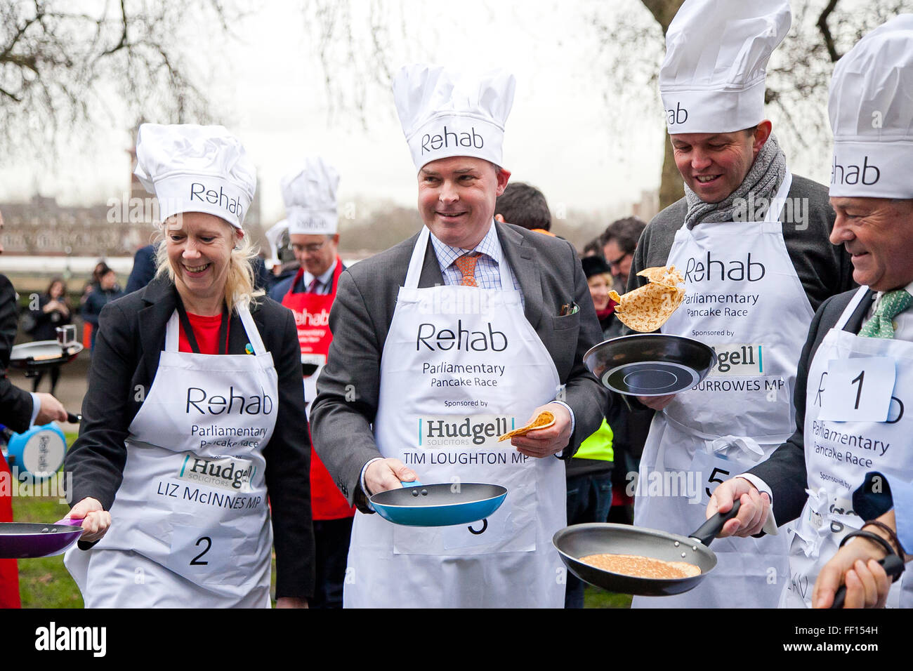 Westminster, London, United Kingdom. February 9th, 2016 -  MP's win the annual Parliamentary pancake race in the aid of the disability charity Rehab and pose for photos while tossing pancakes Credit:  Dinendra Haria/Alamy Live News Stock Photo