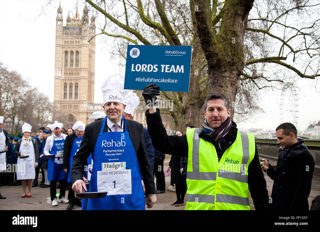 Westminster, London, United Kingdom. February 9th, 2016 - The captain of the Lords' team, Lord Redesdale leads his team at the annual Parliamentary pancake race in Victoria Gardens, Westminster.  Credit:  Dinendra Haria/Alamy Live News Stock Photo