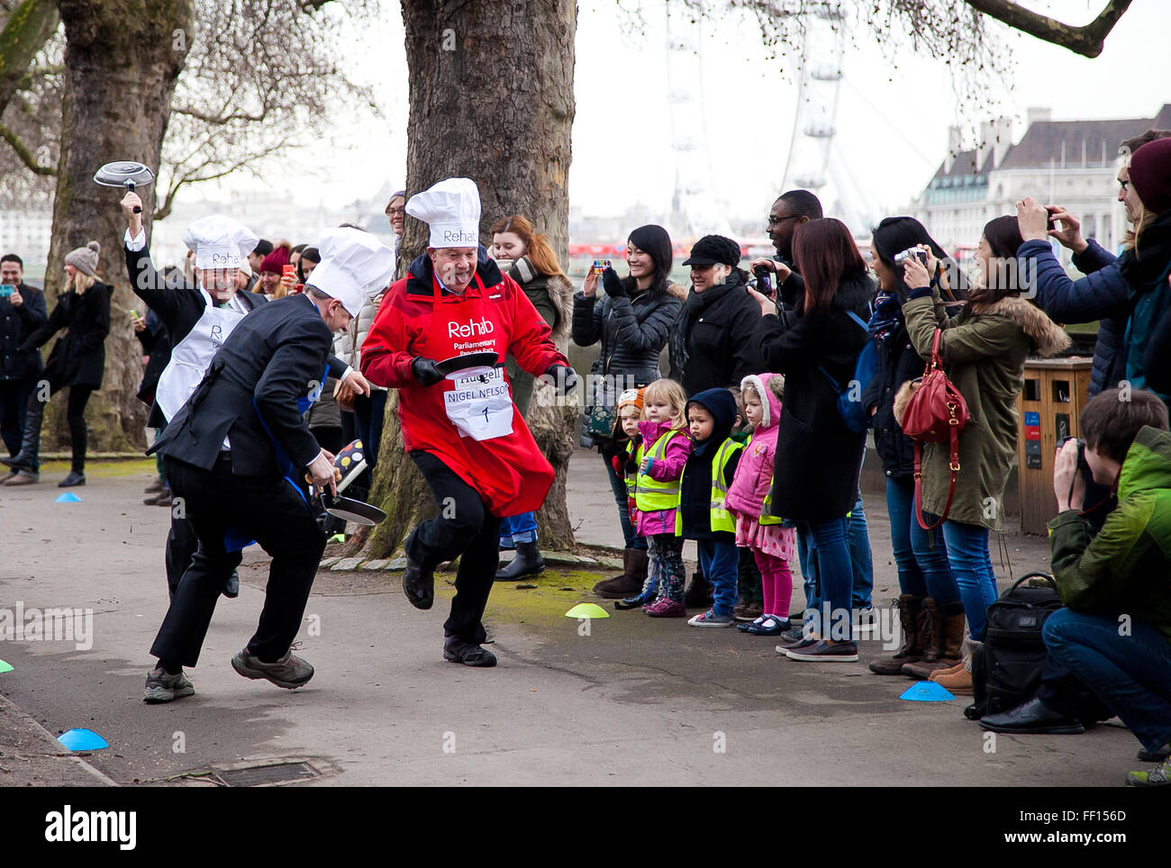 Westminster, London, United Kingdom. February 9th, 2016 - members of the public of all ages watch the annual Parliamentary pancake race in Victoria Tower Gardens in Westminster Credit:  Dinendra Haria/Alamy Live News Stock Photo