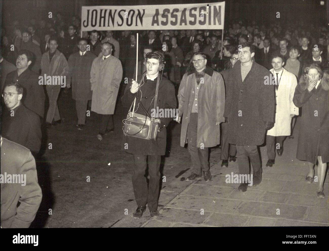1957 - Communists Stage Demonstration Against War In Vietnam: A Communist staged demonstration against the war in Vietnam was held in Paris last night. Photo Shows Stopped by the police on their war to the US Embassy. Johnson assasination sign banner. © Keystone Pictures USA/ZUMAPRESS.com/Alamy Live News Stock Photo