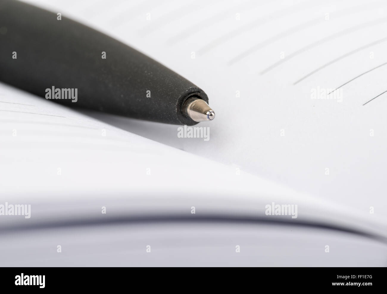 Ballpoint pen closeup lying in an open notebook Stock Photo Alamy