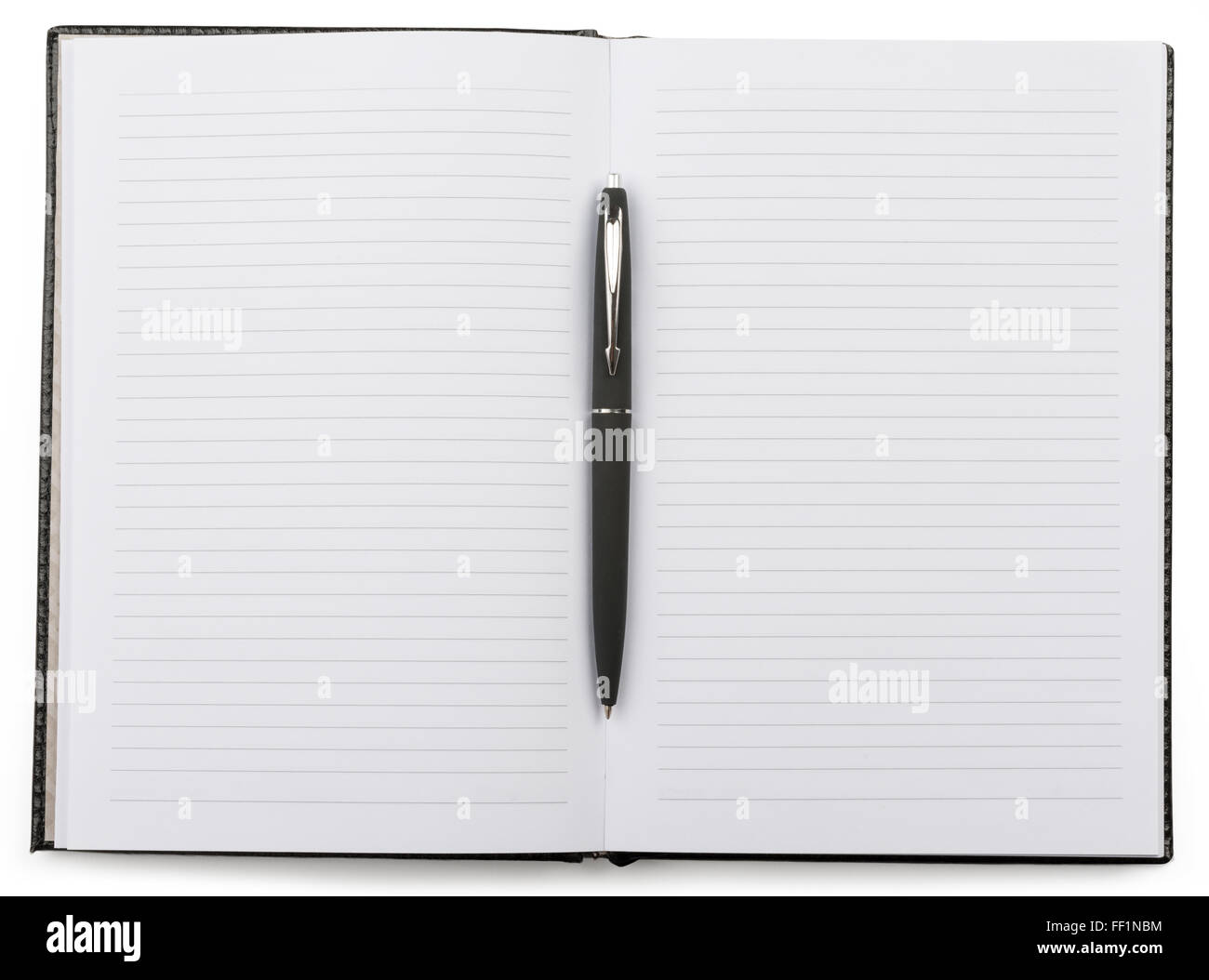 Open notebook with a pen lying in the middle Stock Photo