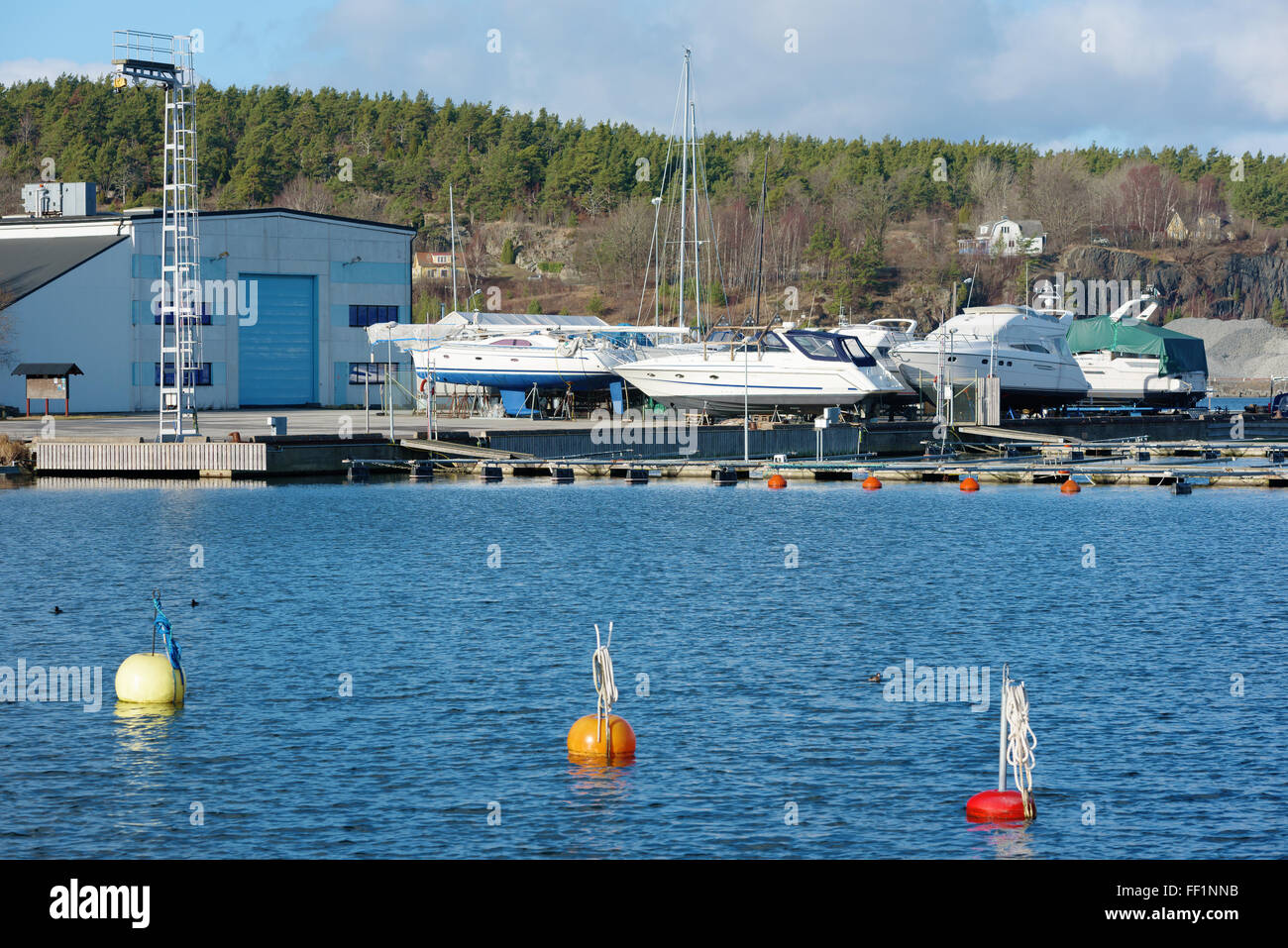 Karlshamn, Sweden - February 04, 2016: Leisure boats in winter storage outdoors in a marina. Stock Photo