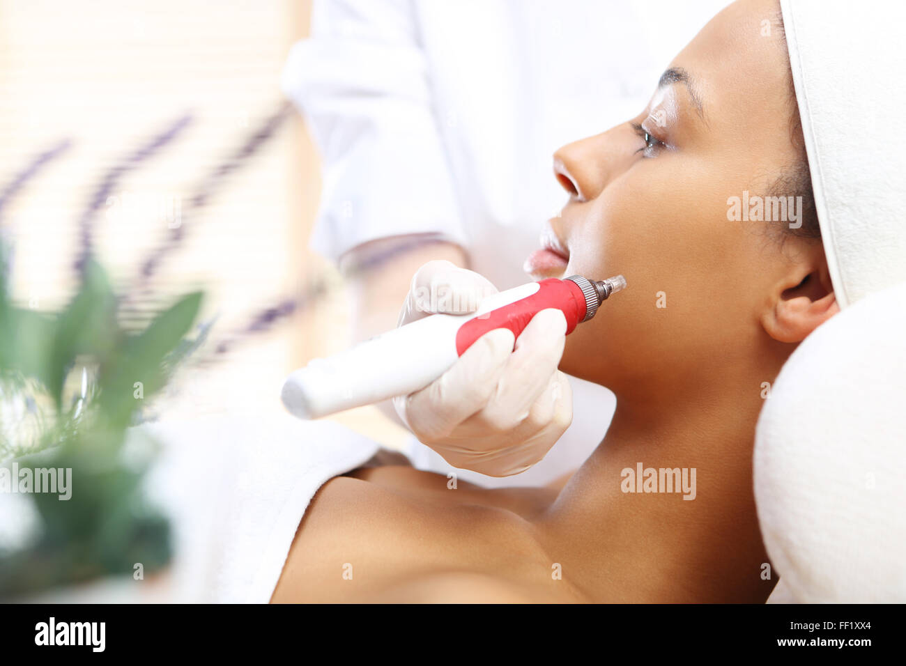 The woman's face during a facial at a beauty salon. Stock Photo