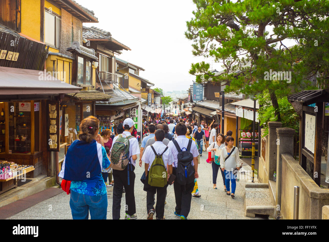 Crowded tourist shopping street Matsubara-dori full of shops and restaurants at base of Kiyomizu-dera in Kyoto, Japan Stock Photo