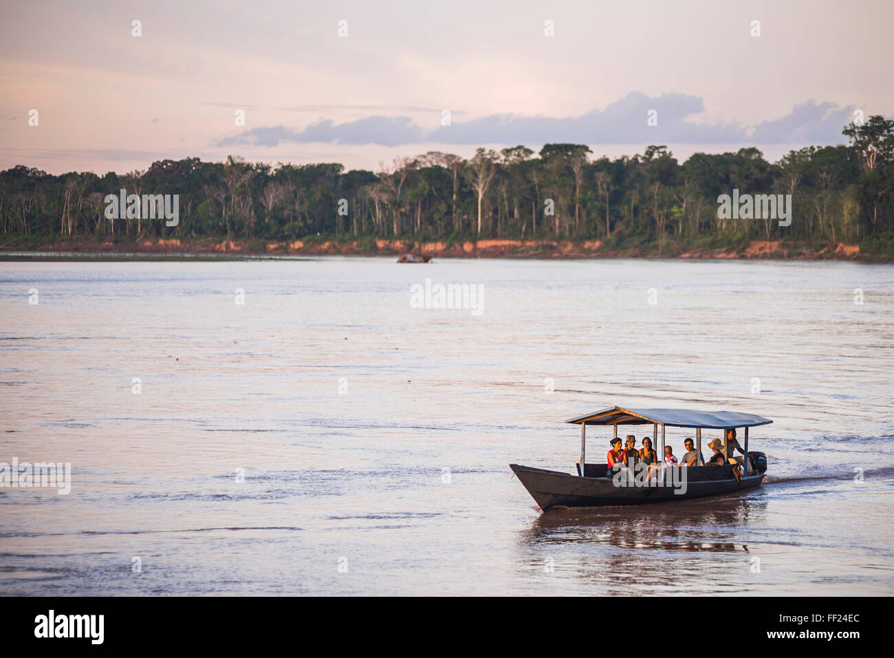 Amazon JungRMe boat trip at sunset, Tambopata NationaRM Reserve, Peru, South America Stock Photo
