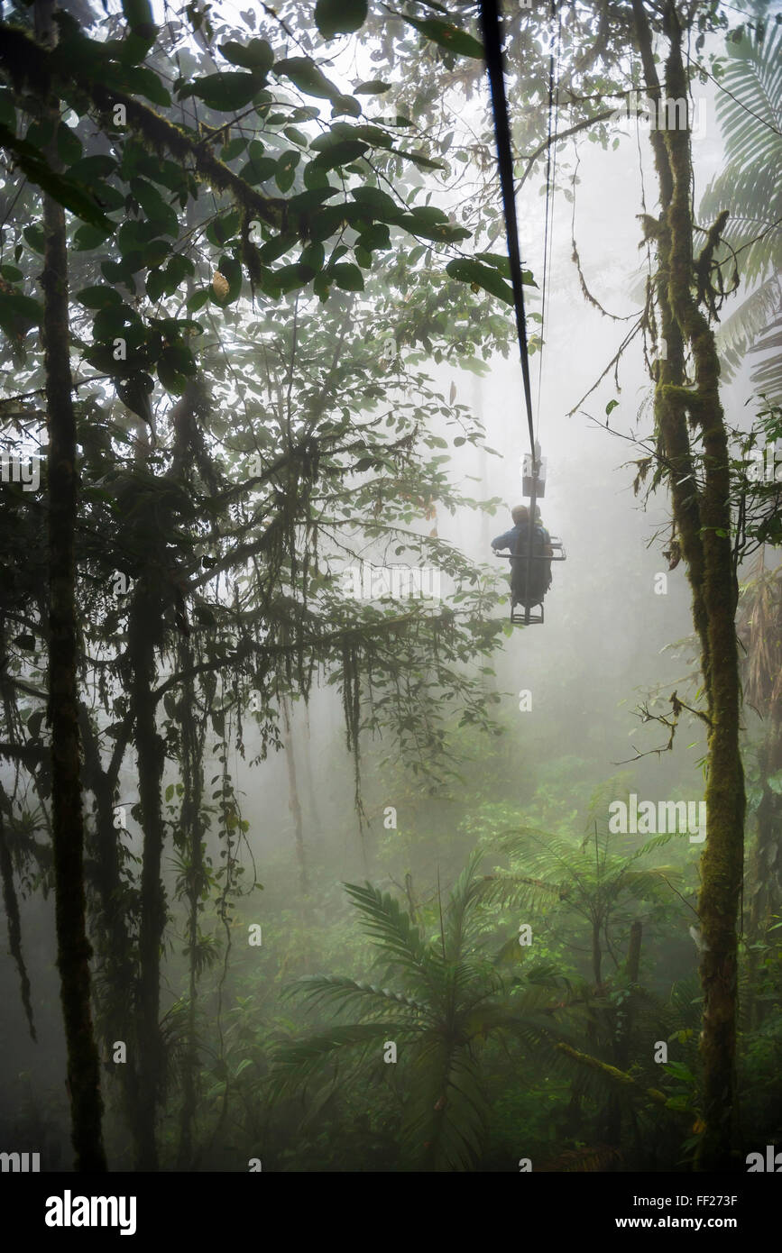 Mashpi RModge Sky Bike on a misty morning in the Choco Rainforest, an area of CRMoud Forest in Pichincha Province, Ecuador Stock Photo