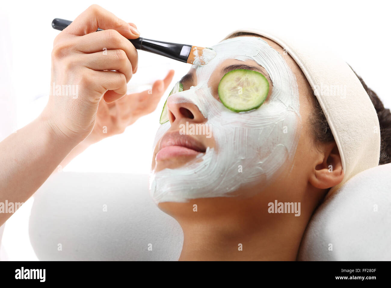 Green clay, natural cosmetics, cleansing and toning the skin. Woman in a beauty salon, Green mask, woman in spa salon Stock Photo