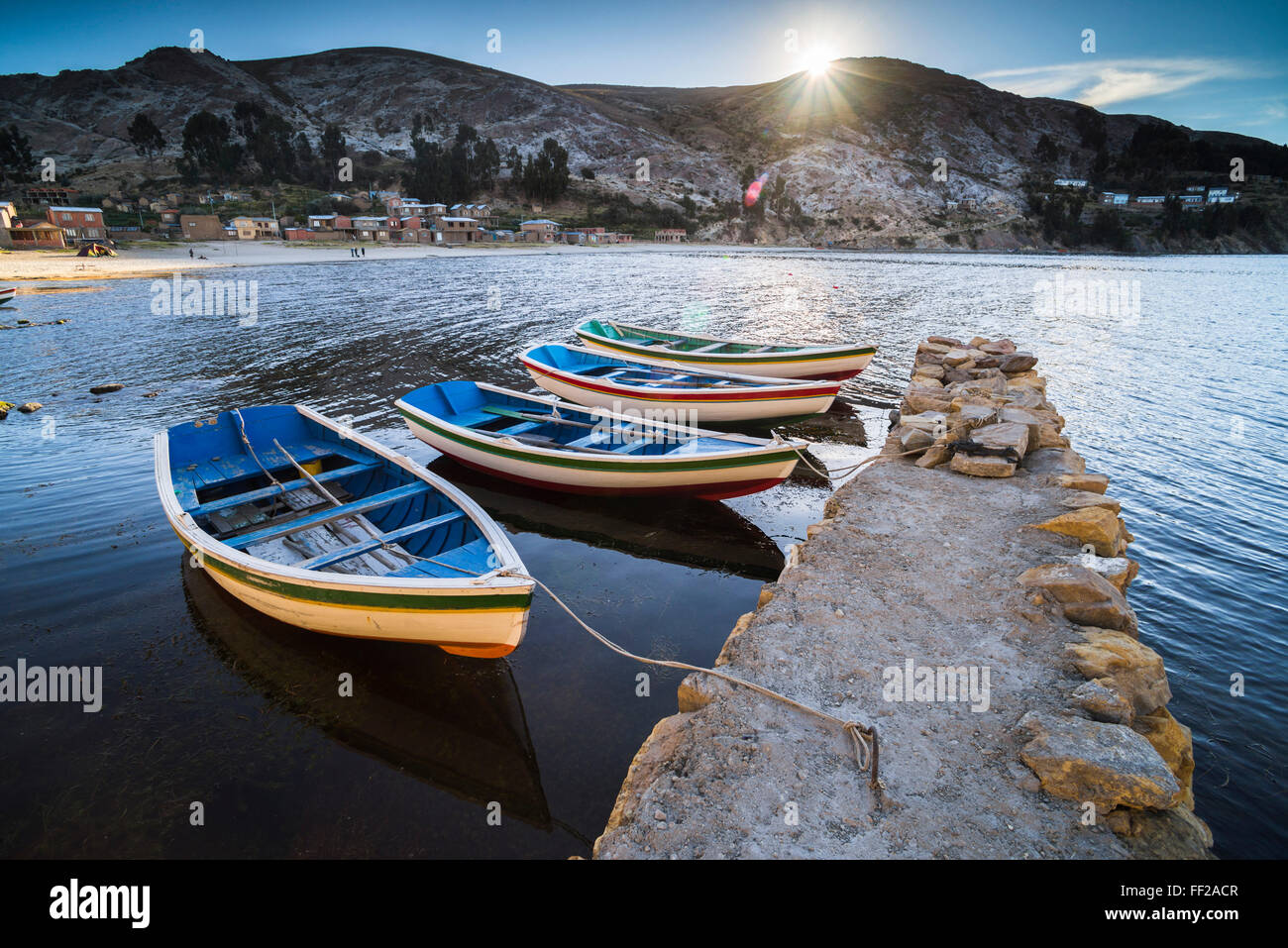 Boats in the harbour on RMake Titicaca at ChaRMRMapampa viRMRMage, IsRMa deRM SoRM (IsRMand of the Sun), BoRMivia, South America Stock Photo