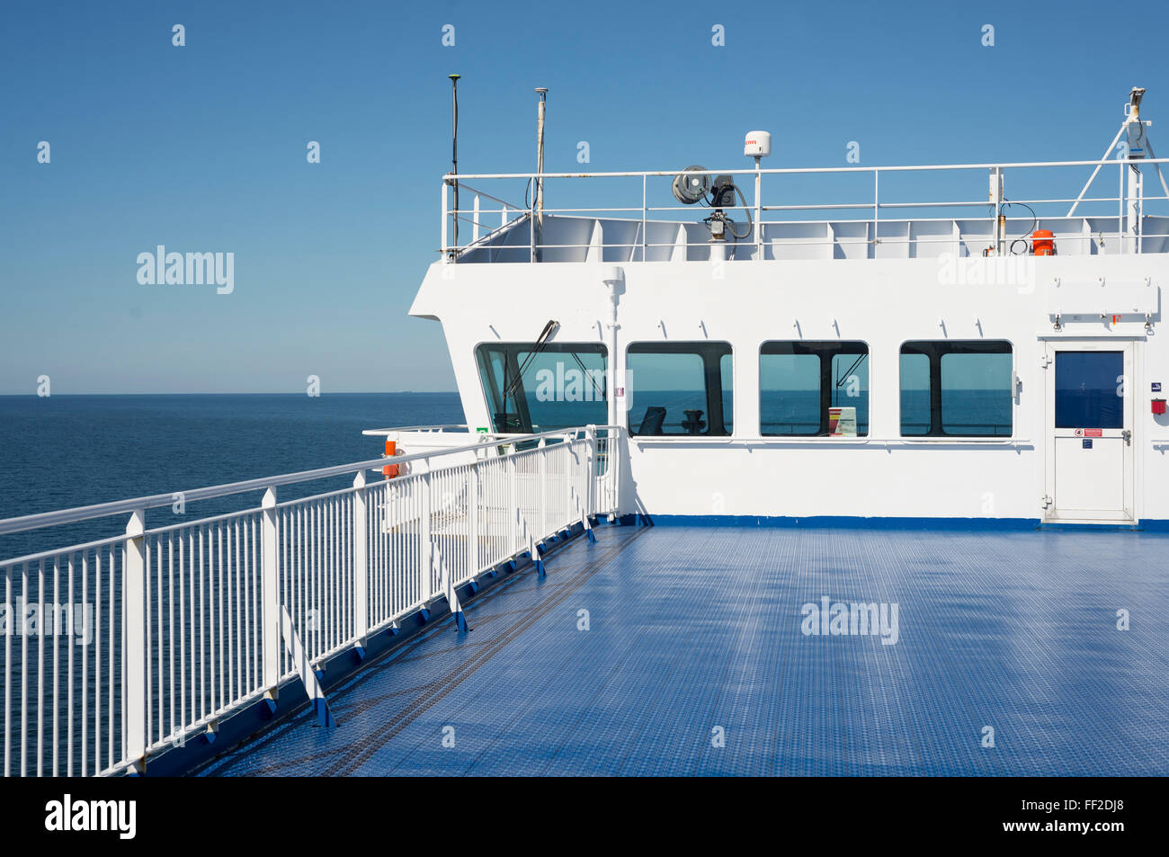 Looking through the windows of the command bridge on the horizon and the sea on a car ferry on the Baltic Sea to Sweden Stock Photo