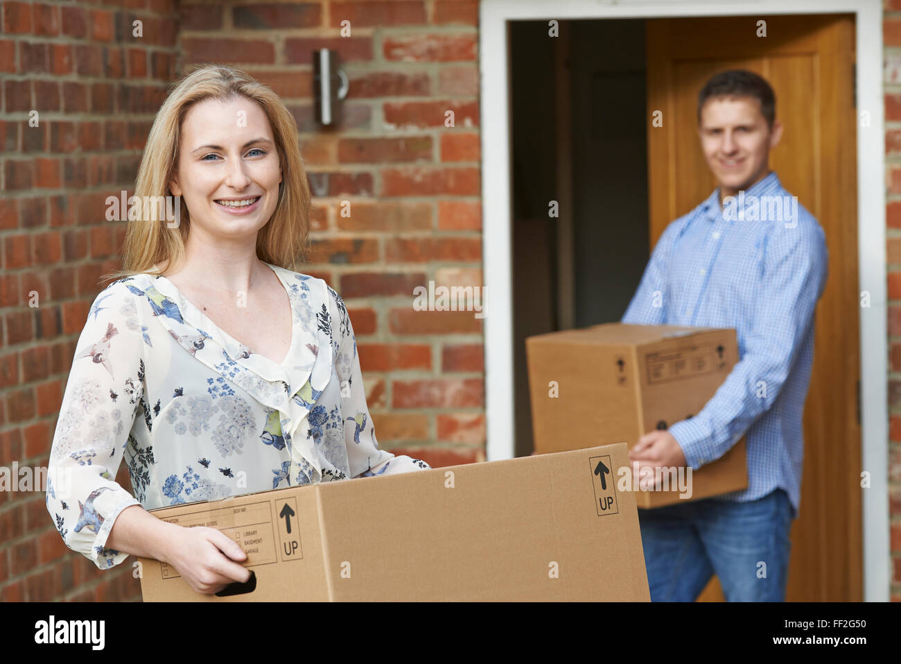 Young Couple Moving Into New Home Together Stock Photo - Alamy