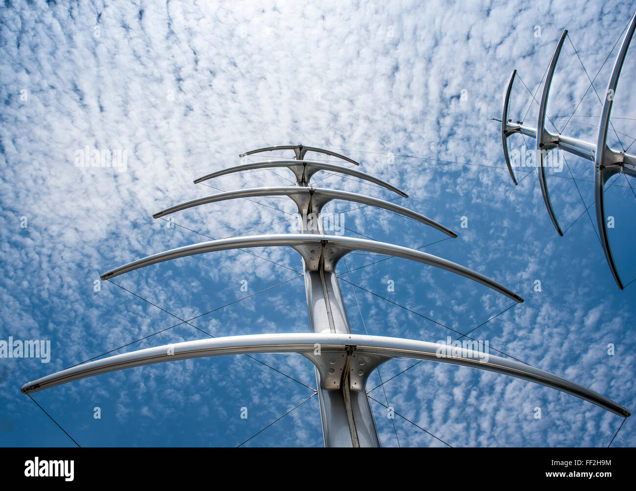 Masts like herringbone and Radar Communication Tower on a Yacht. Detail of luxury white yacht with security camera and navigatio Stock Photo