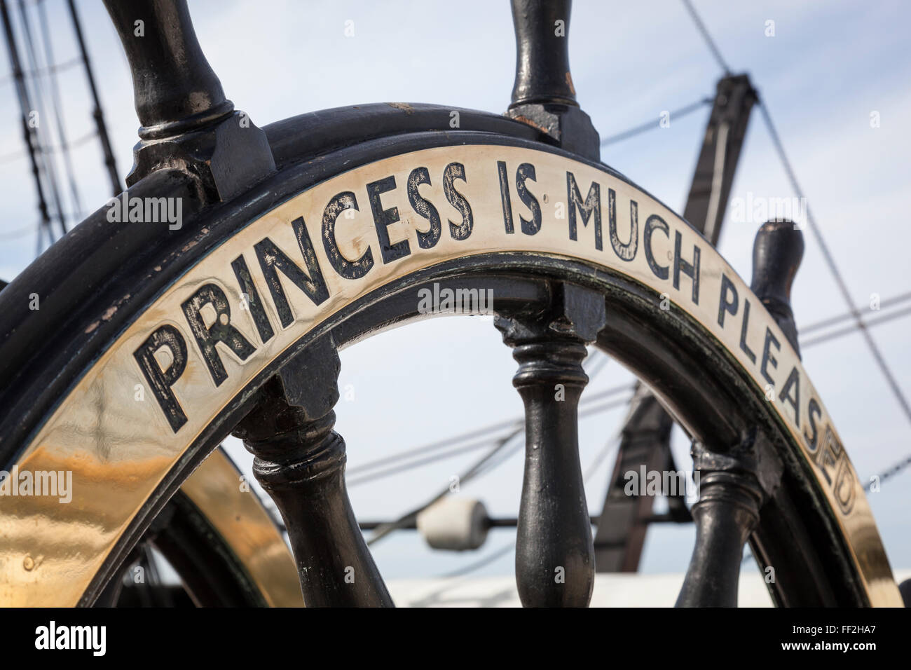 Close-up of the wheel of HMS Warrior bearing the brass plated inscription attributed to Princess Alexandra of Denmark in 1863. Stock Photo