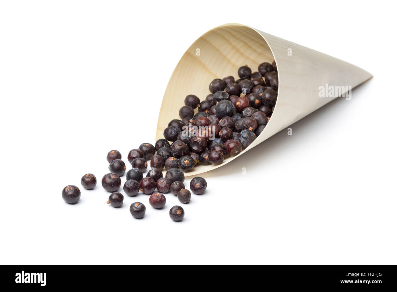 Dried Juniper berries in a sac on white background Stock Photo