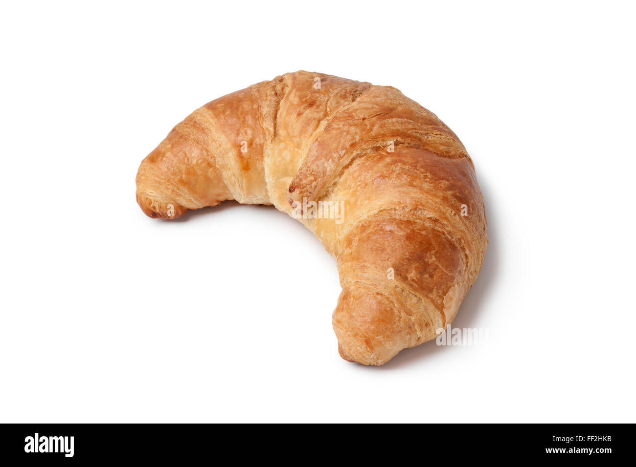 Whole single fresh French croissant on white background Stock Photo