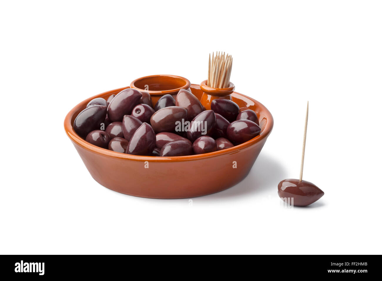 Bowl with black Calamata olives on white background Stock Photo