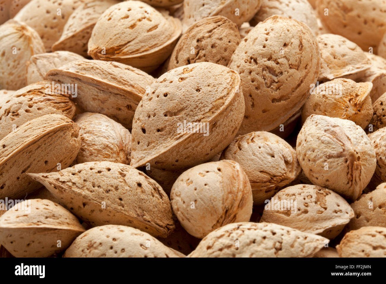 Whole Almonds in the pod full frame Stock Photo
