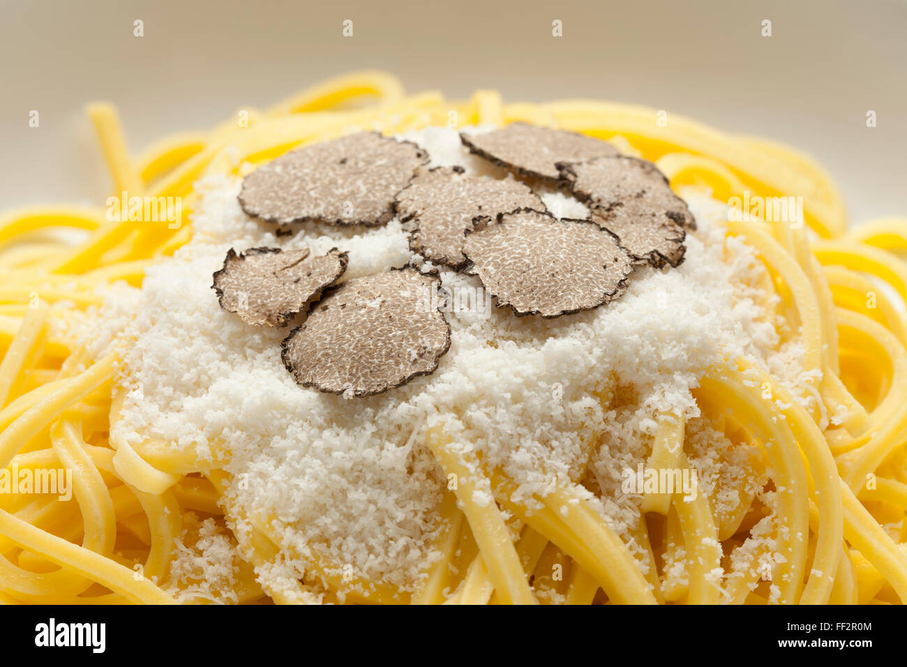 Spaghetti with black winter truffle and Parmesan cheese close up Stock Photo