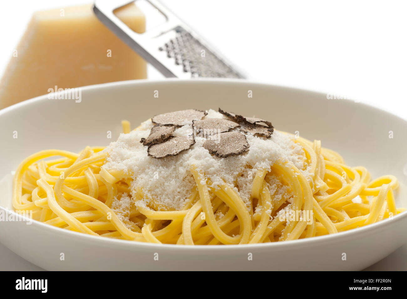 Spaghetti with black winter truffle and Parmesan cheese on a dish Stock Photo