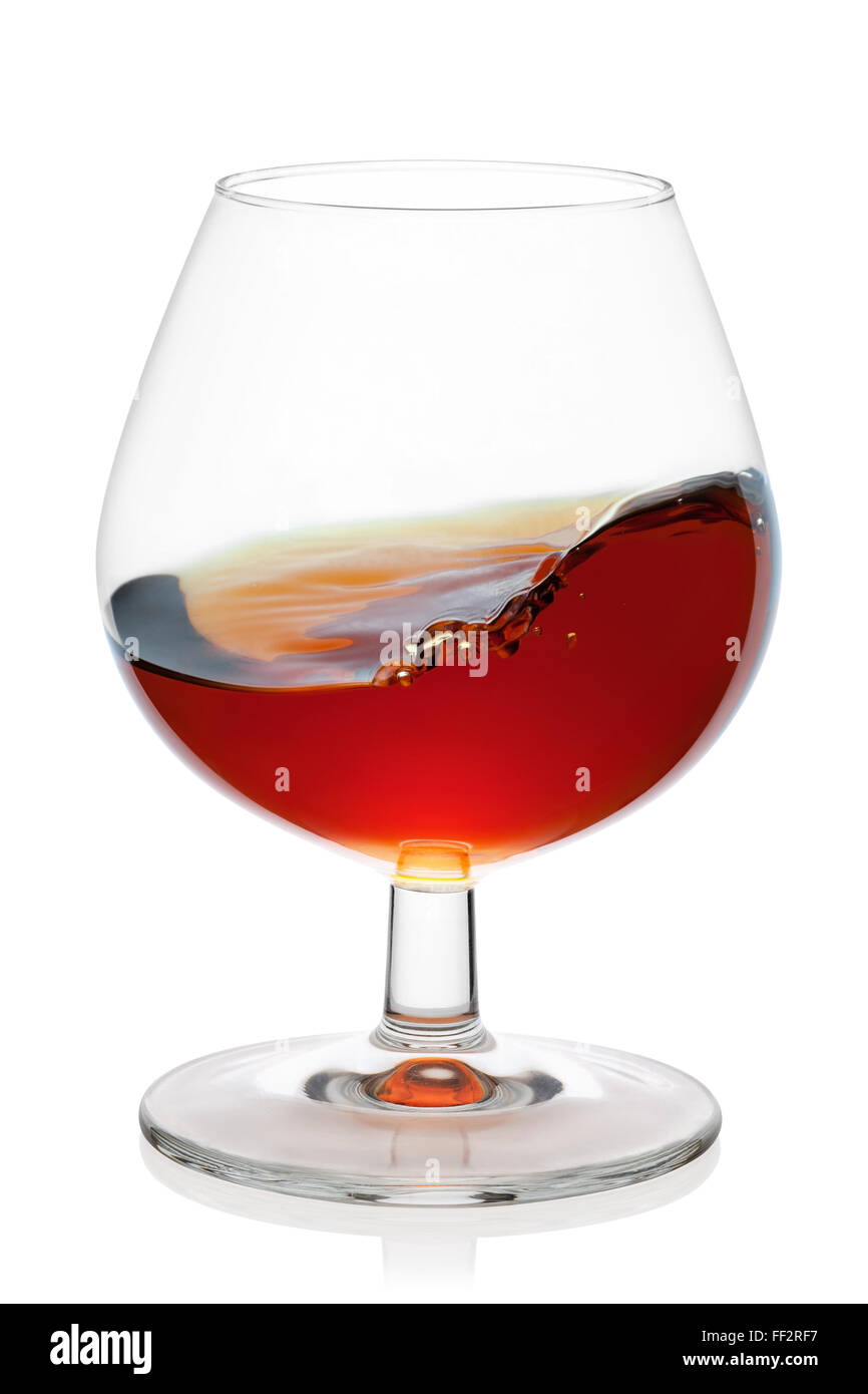 Snifter glass with cognac splash, isolated on the white background