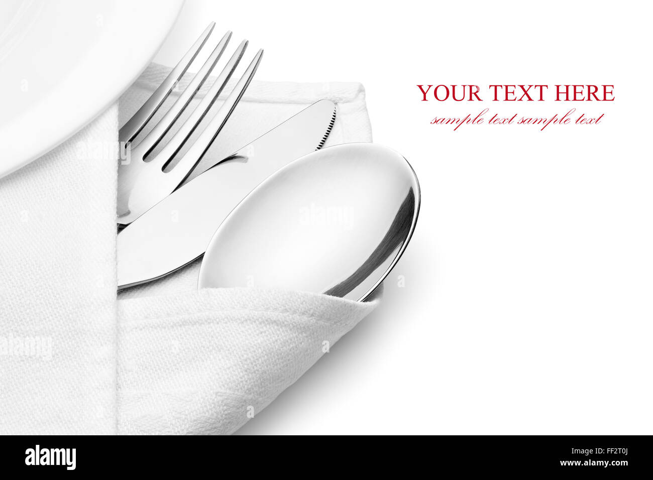 Knife, fork and spoon with linen serviette, isolated on the white background, clipping path included. Stock Photo