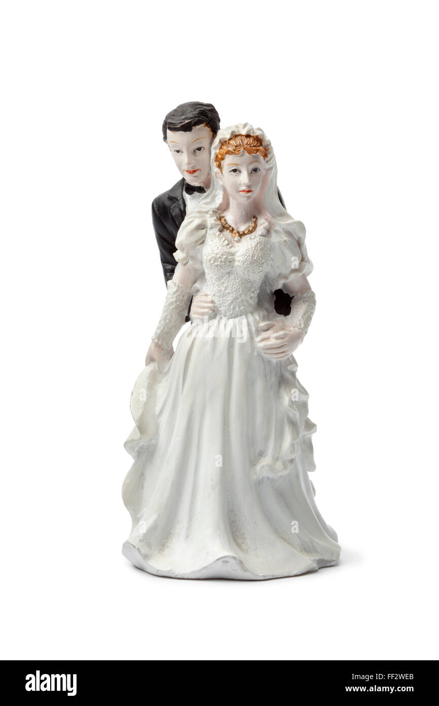 Old plaster bride and groom cake topper isolated on white background Stock Photo