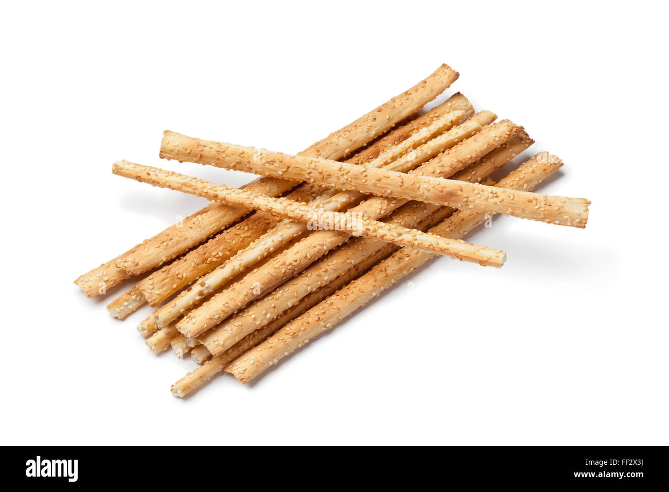 Breadsticks with sesame seeds on white background Stock Photo