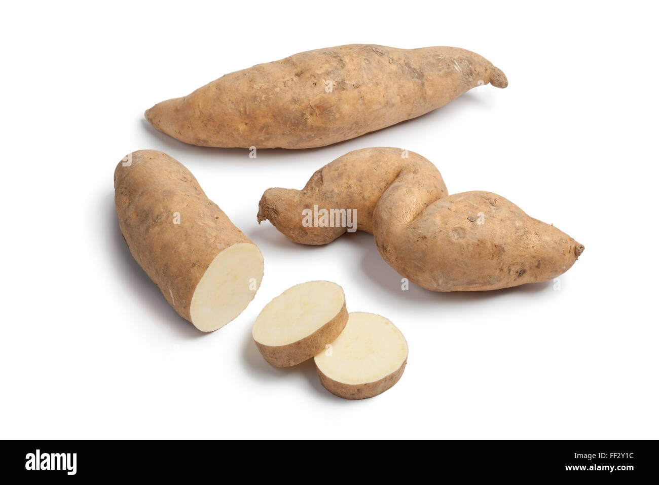 Sweet potatoes and slices on white background Stock Photo
