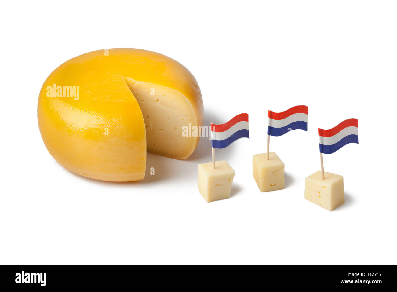 Gouda cheese with dutch flags on white background Stock Photo