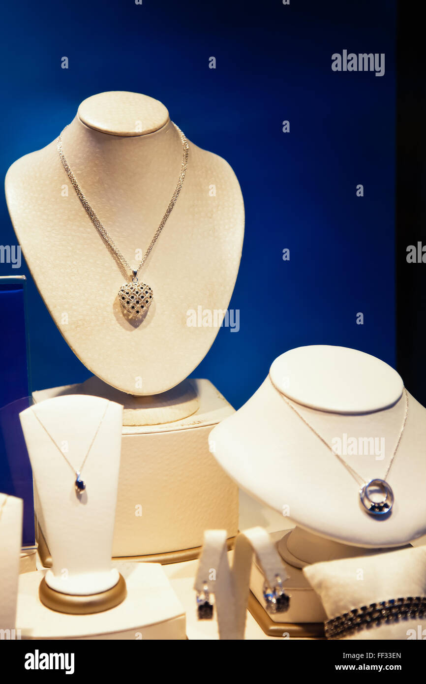 Jewelry store window display of necklaces. Stock Photo