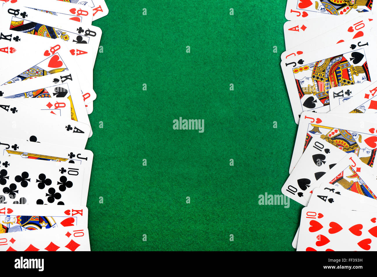 Playing cards isolated on green background Stock Photo
