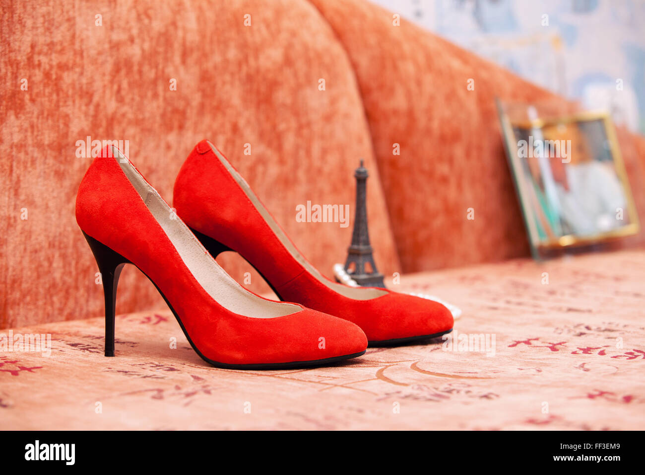 red wedding shoes of the bride on an orange sofa Stock Photo Alamy