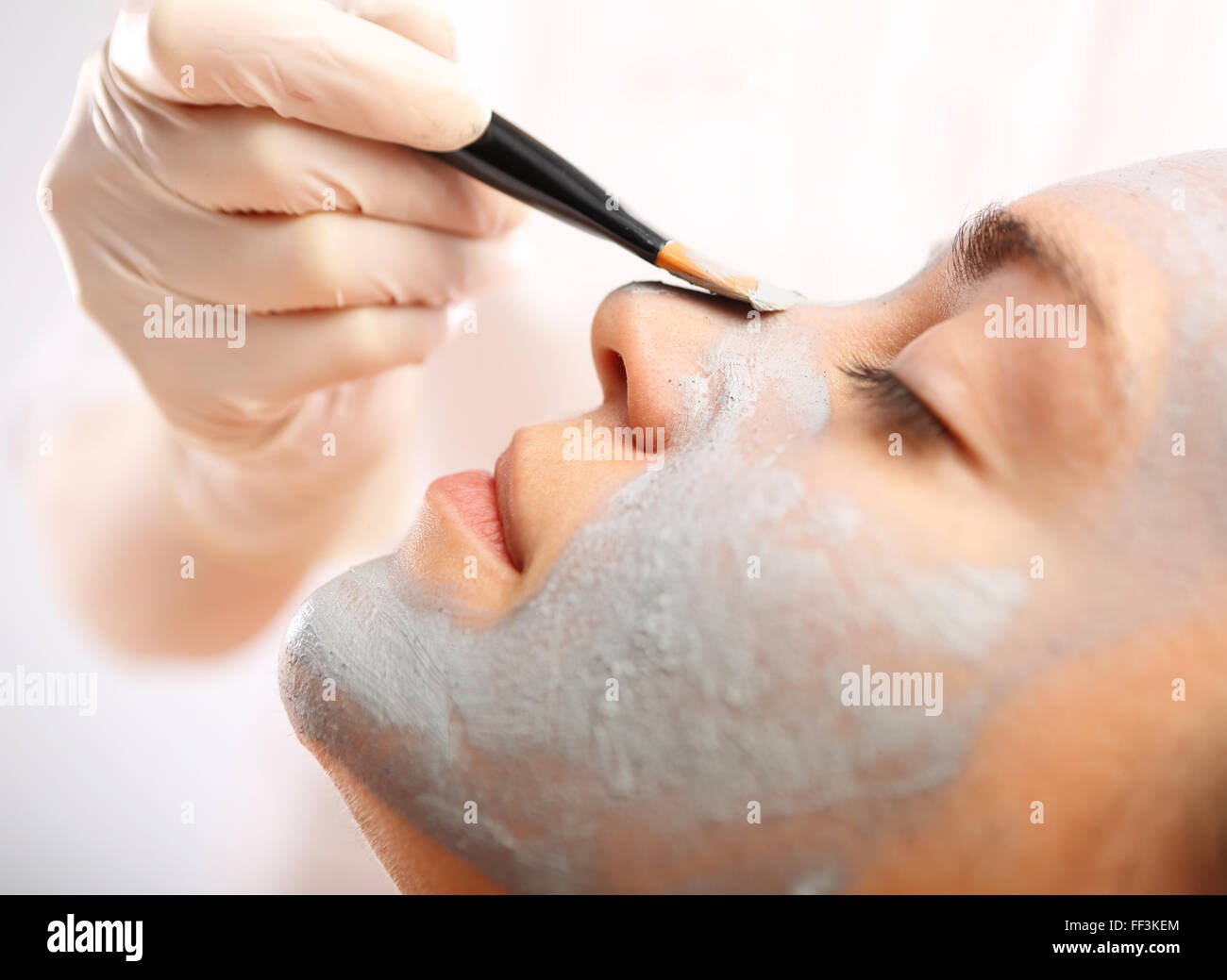 Cleansing facial skin, a woman in beauty salon. Beautiful woman during treatments in the spa