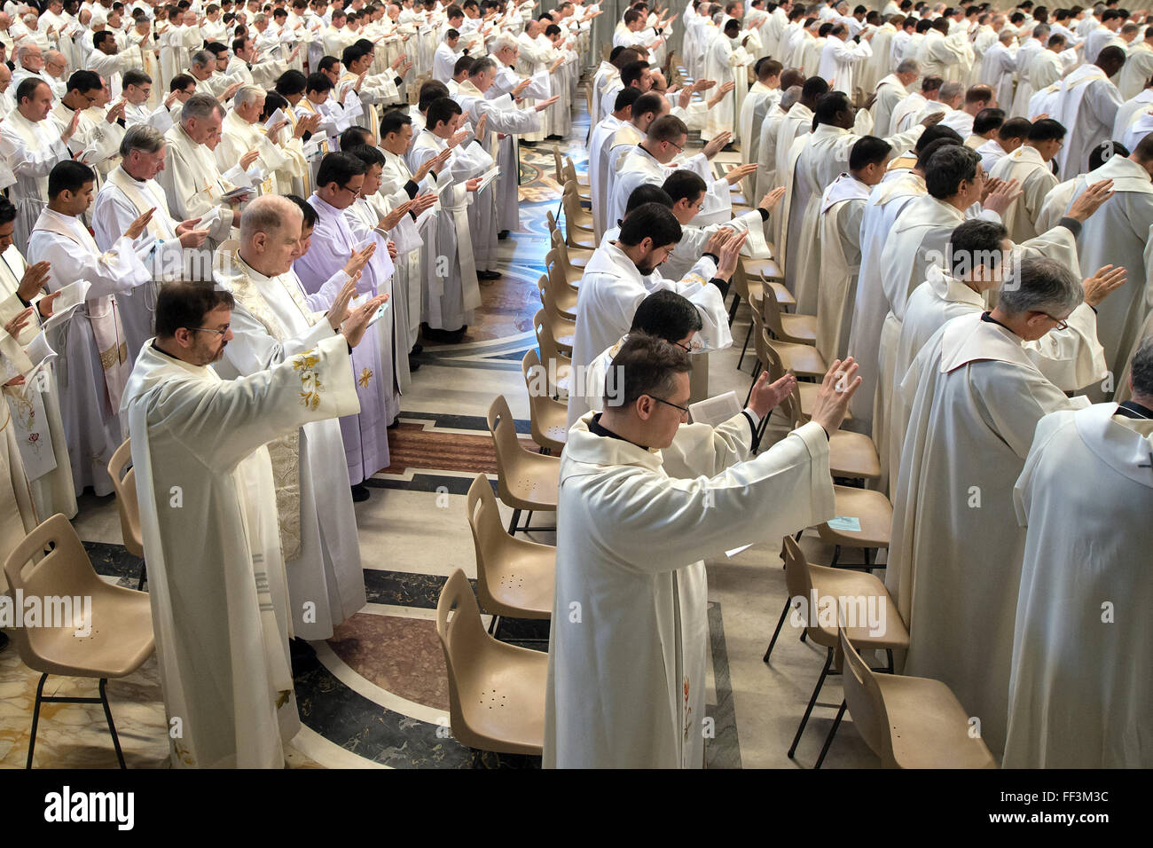 Priests attend the Chrism Mass in St. Peter's Basilica. Preti. Messa ...