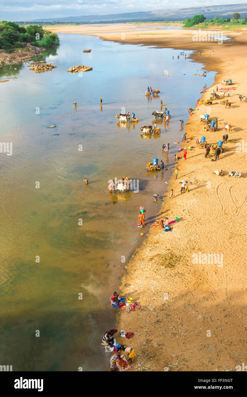 People washing and taking water from the Mandare river, Berenty, Fort Dauphin, Toliara Province, Madagascar Stock Photo