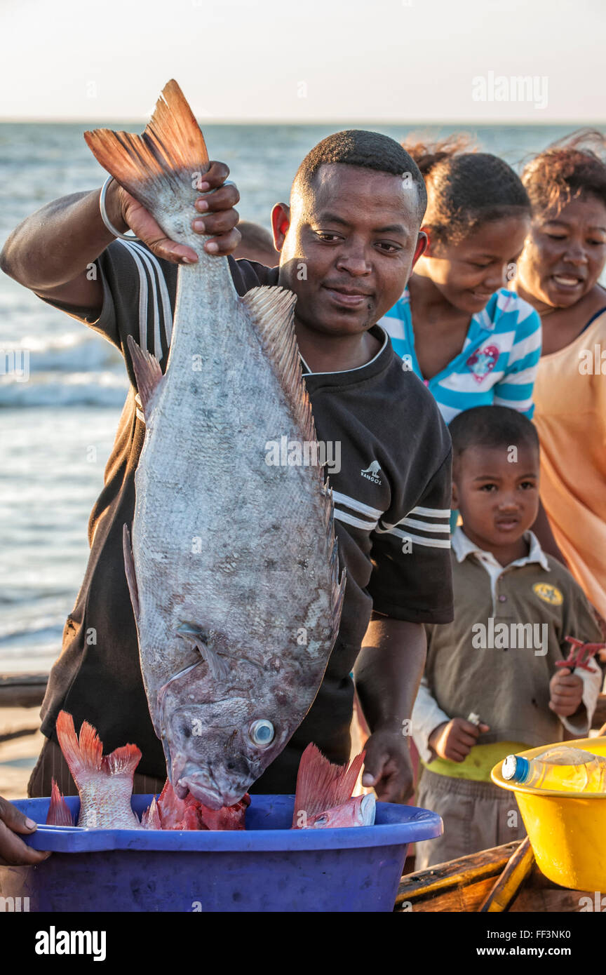 Malagasy Fisherman showing his catch, Morondava, Toliara province ...