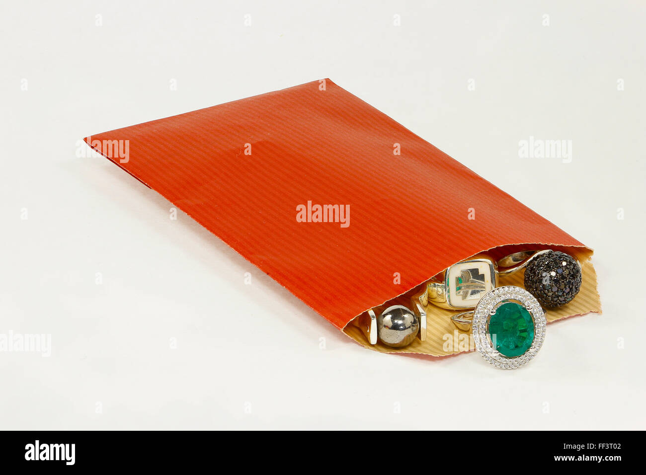 Silver and golden rings in red envelope Stock Photo Alamy