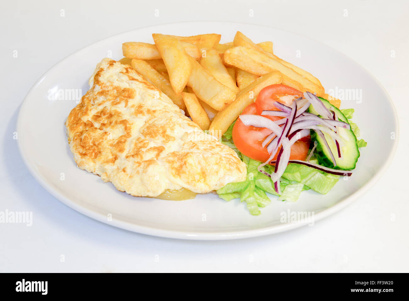 Omelette meal with chips and salad Stock Photo