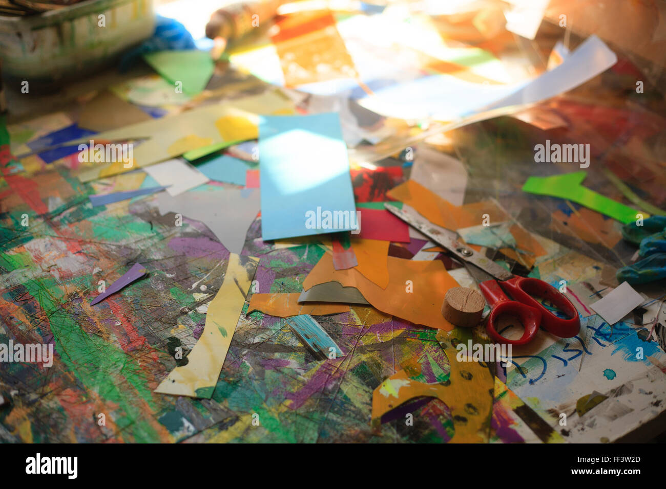 Paper, scissors and other materials in an artist's studio Stock Photo