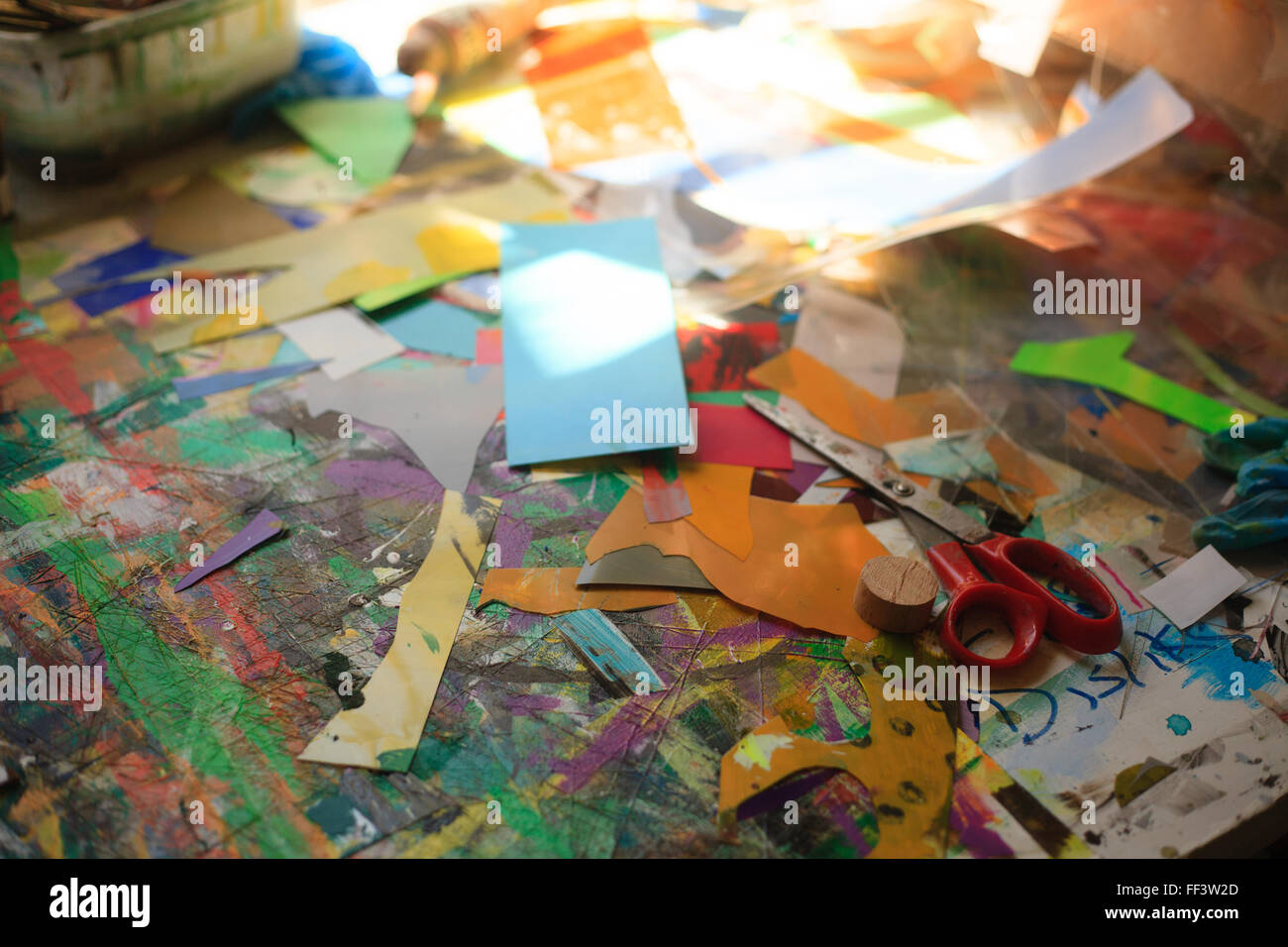 Paper, scissors and other materials in an artist's studio. Stock Photo