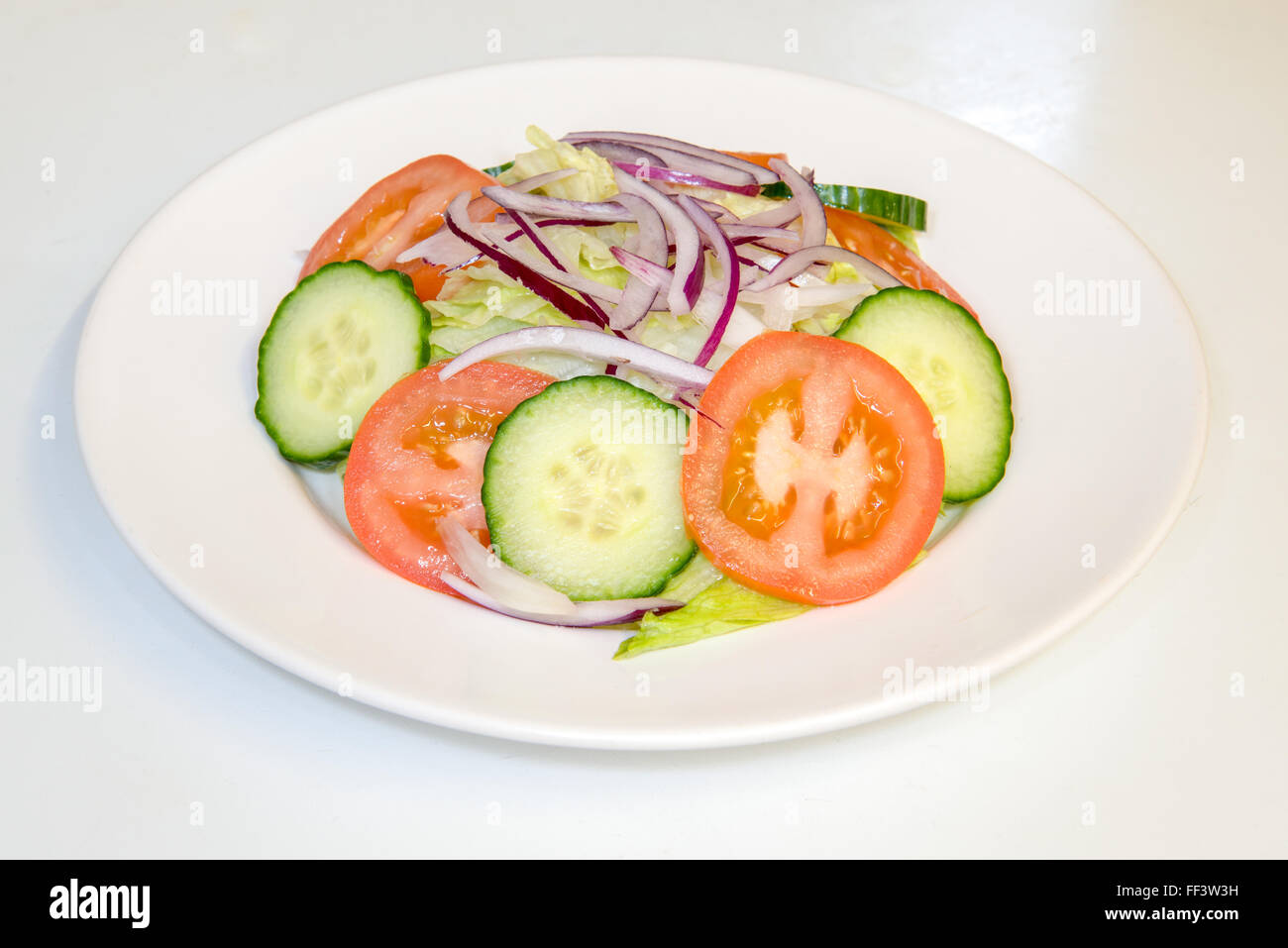 Large salad on a white plate Stock Photo