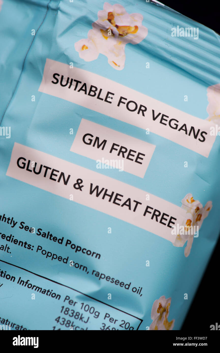 Suitable for vegans, gm free and gluten and wheat free labels on a packet of  Propercorn flavored popcorn Stock Photo
