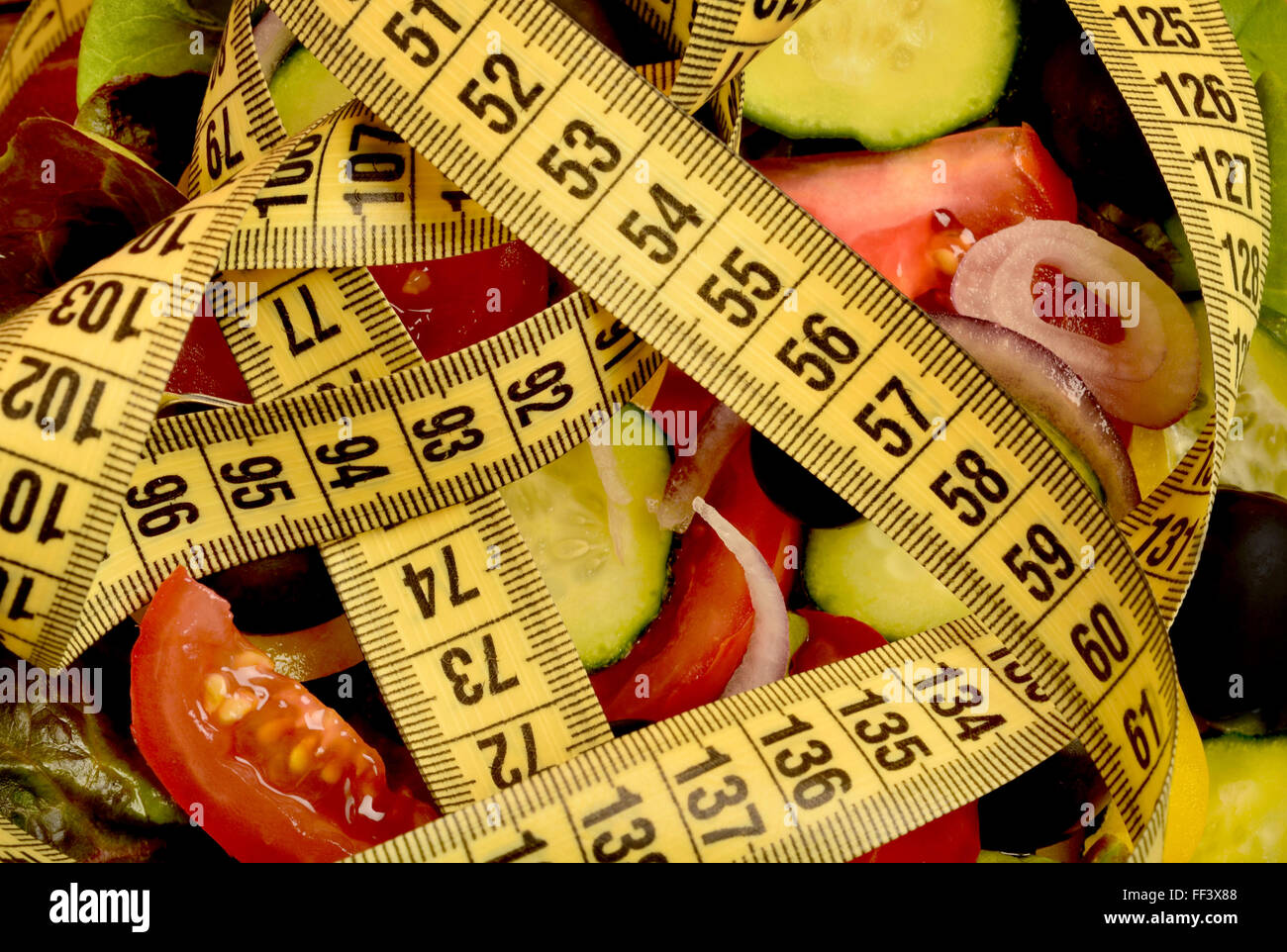 Vegetable salad with centimeter on background Stock Photo