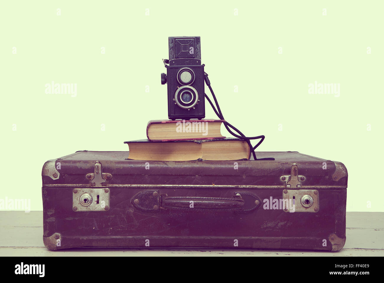 Vintage suitcases with books and camera Stock Photo