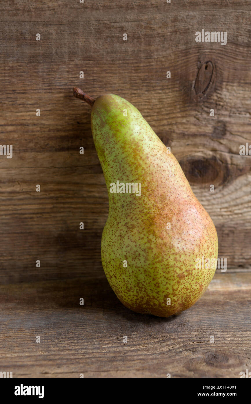 Pear on wooden background, natural light Stock Photo