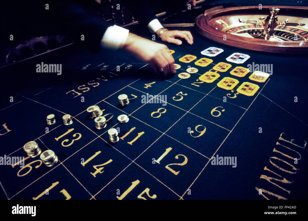 Real silver and gold metal chips have been used for high-stakes betting at the roulette tables during the two-century-old history of Casino Baden-Baden in the Kurhaus in the Black Forest (Schwarzwald) of Germany. Nowadays the chips are only brought out for play on special occasions, along with large rectangular gaming plaques of greater values. The Baden-Baden casino is one of the world's most luxurious gaming palaces and a major attraction in that famed European spa town. Stock Photo