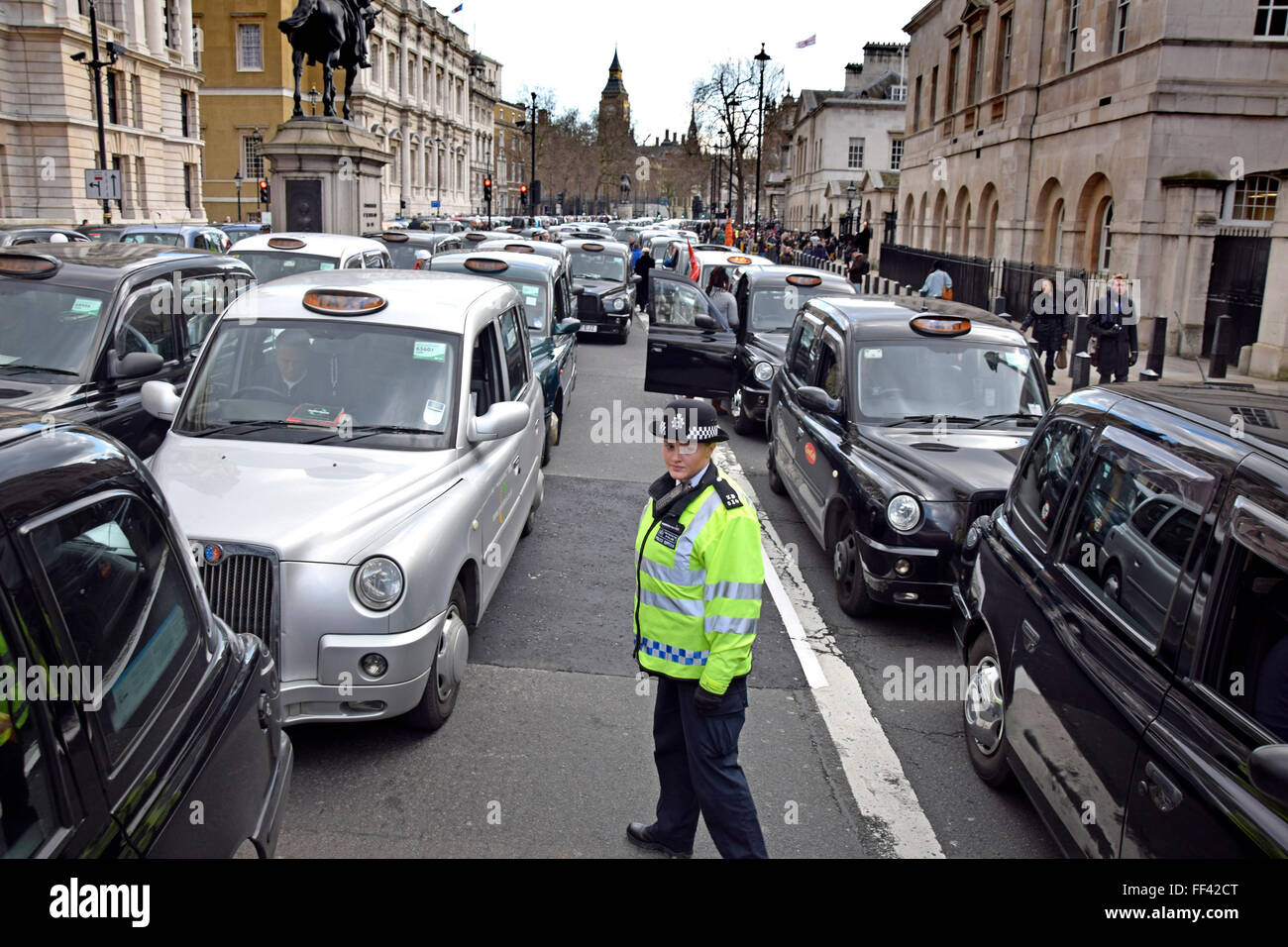 London, UK. 10th February, 2016. Thousands of black cab drivers bring central London to a standstill in protest at the deregulation of taxis and the rise of Uber. Whitehall. Credit:  PjrNews/Alamy Live News Stock Photo