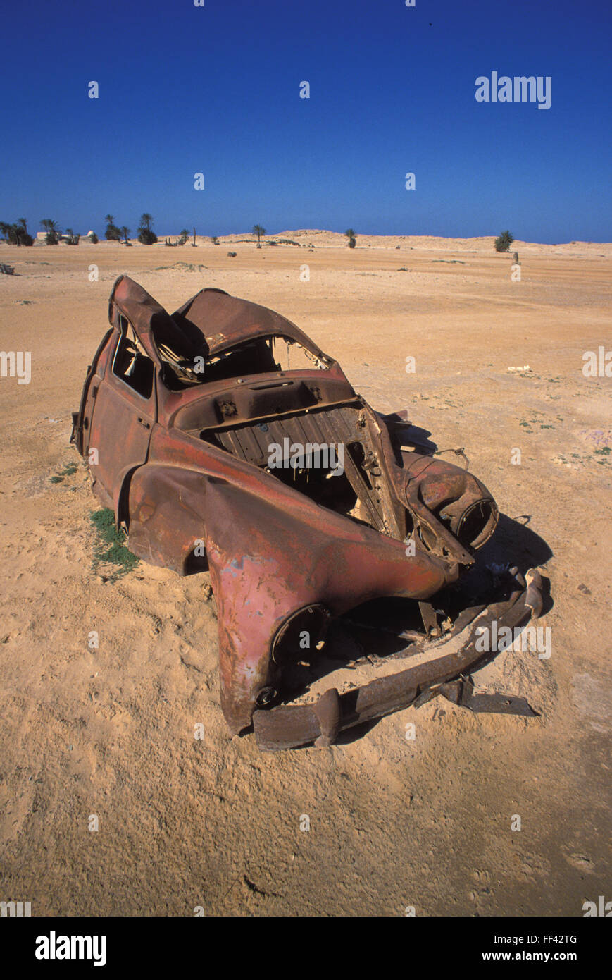 TUN, Tunisia, Jarbah Island, rusty car at the beach near Houmt Souk.  TUN, Tunesien, Insel Djerba, verrostetes Auto am Strand na Stock Photo